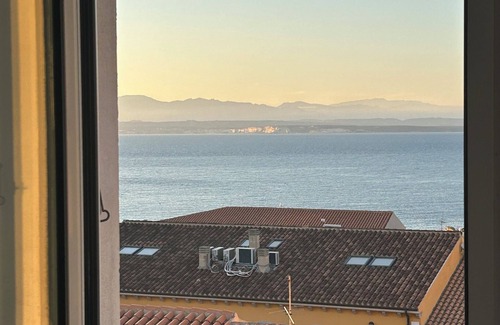 Santa Teresa di Gallura Apartment | Seaview cozy penthouse 300m walk to the beach, large terrace. Center Village.