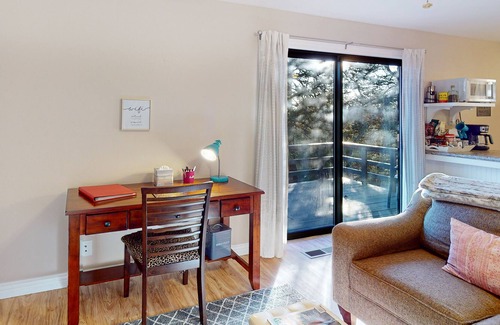Holiday Island Condo | Secluded home near lake with a deck, wooded views & WiFi