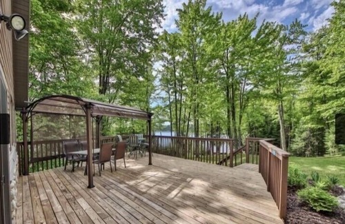 Florence House | Secluded lakefront property, sand beach, water slide, kayaks, and paddleboards!