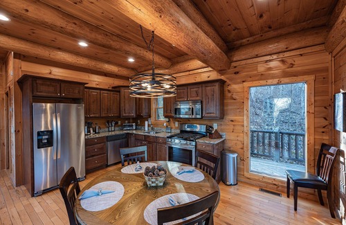 Almond Cabin | Secluded log cabin with fireplace and hot tub on deck.