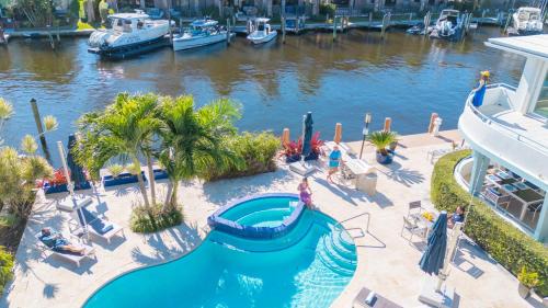 Coral Ridge House | Secluded retreat Heated pool Dock Access Quiet Neighborhood SaltAire Key RESlDENCES