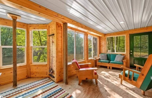 Evart Cabin | Secluded Riverfront Cottage | Sauna, Fire & Kayaks