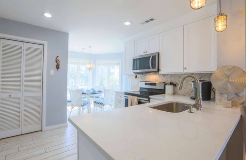 Isle of Palms Condo | See, Feel & Hear the Ocean from this Light-Filled Condo w/Community Pool & Private Screened Porch.