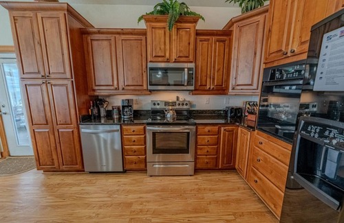 Wind Over Waves House | Semi-Soundfront: Pool, Hot Tub, Game Room, Elevator, Boat Ramp, Linens Included