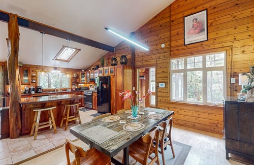 Volcano House | Serene 5-acre tropical hideaway with lanai and circular wood-burning fireplace