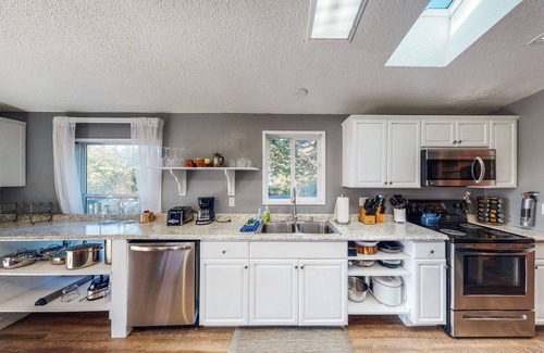 Port Orford House | Serene waterfront haven with lake views, fenced yard & home office