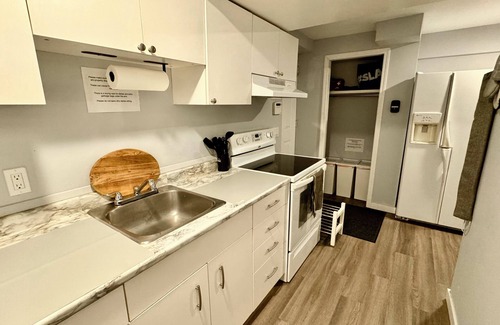 Calgary Apartment | Short or Long Term | Pet Friendly | Dog Park | King Bed | Workspace for 2