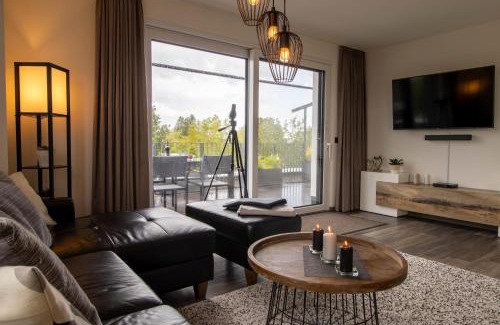 Fedderwardersiel Apartment | Sielhuus 11 Ferienwohnung mit Dachterrasse und Infrarotsauna und Kamin für bis zu 4 Personen in Fedderwardersiel!