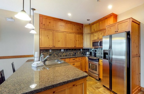 Big White Ski Resort Condo | Ski-in/out village center condo with private hot tub & mountain views