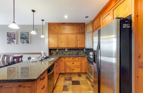 Big White Ski Resort Condo | Ski-in/out village center condo with private hot tub & mountain views