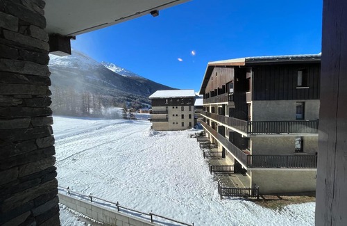 Lanslevillard Apartment | Ski-In/Ski-Out Apartment for 4 with Balcony and Parking in Val Cenis