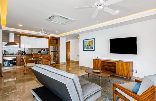 Mismaloya Condo | Sleek 9th-floor condo with wraparound balcony, ocean views & pool