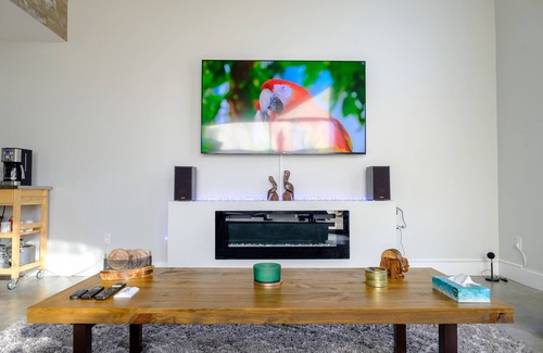 Stevensville House | Sleek forest retreat: karaoke, spa, campfire, pool table, grill, outdoor games