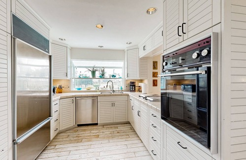 Pierpont Bay House | Snowbird-friendly house with fireplace & rooftop deck - beach across the street