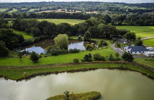 Hadlow Down House | Snug & Secluded Lakeside Shepherds Hut 'Carp'