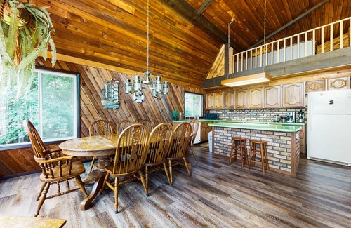 Anderson Island House | Sound view home full of vintage charm with game room, wood stove, & gas grill