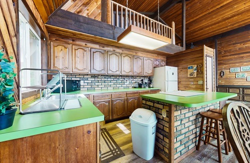 Anderson Island House | Sound view home full of vintage charm with game room, wood stove, & gas grill