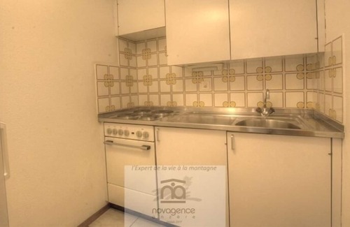Monteiller Apartment | South facing studio with balcony, 1 double bed, 1 bathroom/WC, sofas, chimney and TV. The closed kit