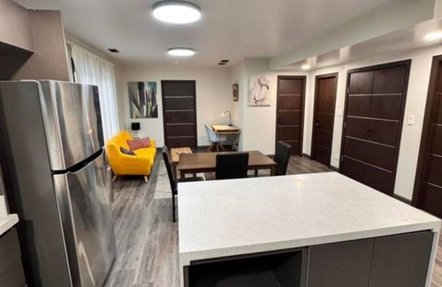 Evanston Apartment | Spacious 2BR Family-Friendly Stay, 4 Queen Beds + 2 Baths, Parking & Laundry.