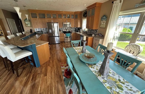 Prudenville House | Spacious 4-bedroom lakefront house on Houghton Lake with beach and tiki bar