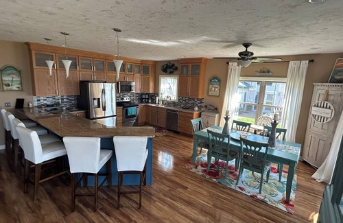 Prudenville House | Spacious 4-bedroom lakefront house on Houghton Lake with beach and tiki bar