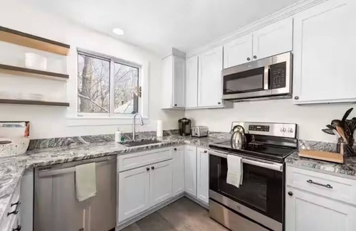 Campton House | Spacious 4-bedroom townhome with amenities in Waterville Estates.