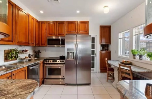Long Beach House | Spacious 5-bedroom ocean view house in serene Long Beach with fitness room.