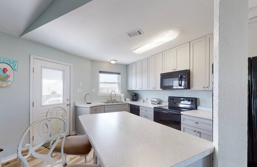 Royal Lagoons House | Spacious bay front getaway with dock, canal access, gas grill, & furnished deck