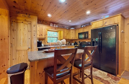 Cullowhee House | Spacious cabin near lake & boat ramp with firepit, foosball, bar, decks & WiFi