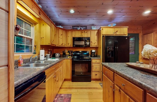 Cullowhee House | Spacious cabin near lake & boat ramp with firepit, foosball, bar, decks & WiFi