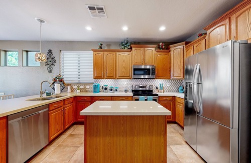 Glendale House | Spacious home surrounded by palms with pool, grill, children's items, & W/D