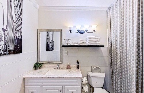 Midtown House | Spacious home with yard, deck, W/D, on-site parking & central AC