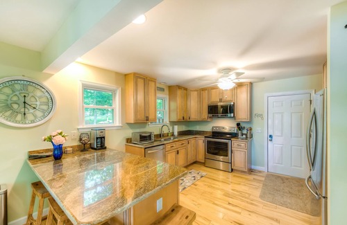 Blue Water House | Spacious lake lodge with a private dock, wraparound decks & foosball