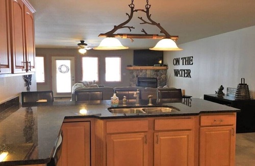 Arkdale Condo | Spacious lake view 1st floor condo at Northern Bay Marina & Golf Resort