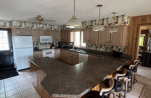 Minong Cabin | Spacious lakefront cabin on beautiful sand bottom Leader Lake.
