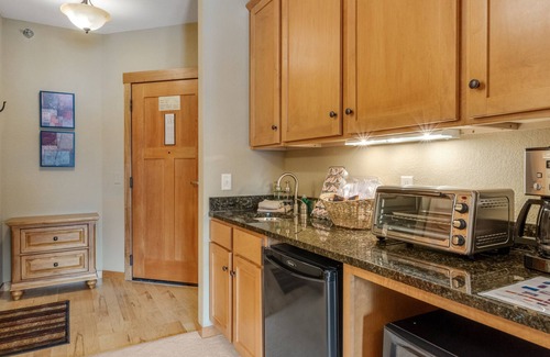 Three Lakes Condo | Spacious lakefront studio with kitchenette, balcony, pool, hot tubs, & firepit