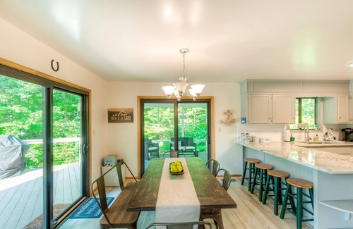 Bumpass House | Spacious lakeside home featuring a private cove, hot tub, dock & theater room