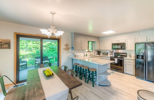 Bumpass House | Spacious lakeside home featuring a private cove, hot tub, dock & theater room