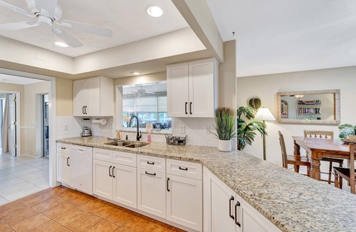Venice Gardens House | Spacious lakeside home with modern kitchen, heated pool, and central AC