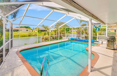 Venice Gardens House | Spacious lakeside home with modern kitchen, heated pool, and central AC