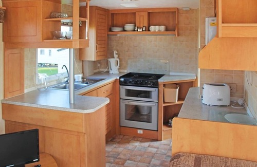 Sandown House | Spacious modern caravan with one double and two twin.