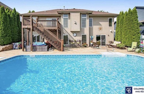 Omaha House | Spacious pool house with tons of amenities, your perfect family vacation spot!
