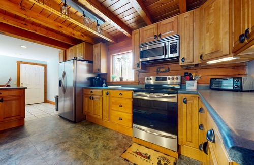 Chester House | Spacious retreat with private hot tub, game room, deck, fireplace, & W/D