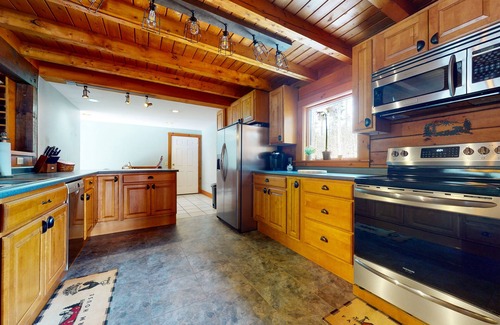 Chester House | Spacious retreat with private hot tub, game room, deck, fireplace, & W/D