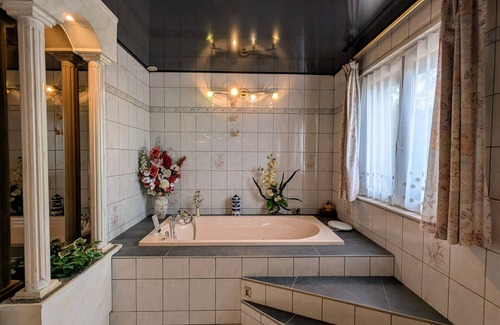 Anould Bed & Breakfast | Spacious room with balcony and heated pool access
