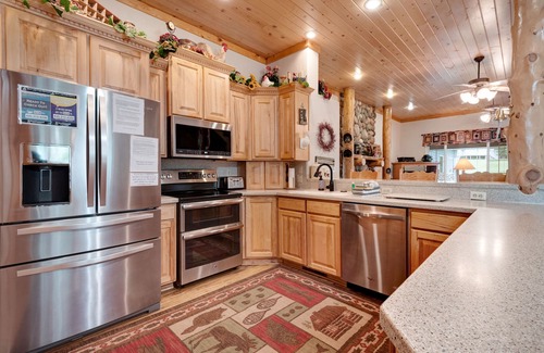 Garden City House | Spacious Waterfront Getaway with Private Hot Tub, Furnished Deck, and Game Room