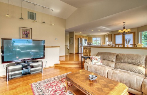 Helios Hills House | Spacious & Welcoming Home with Lake View, Private Hot Tub, & Wraparound Deck