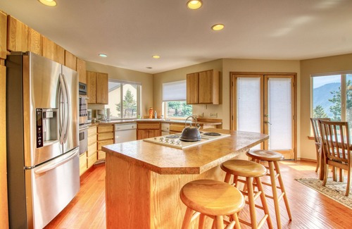 Helios Hills House | Spacious & Welcoming Home with Lake View, Private Hot Tub, & Wraparound Deck