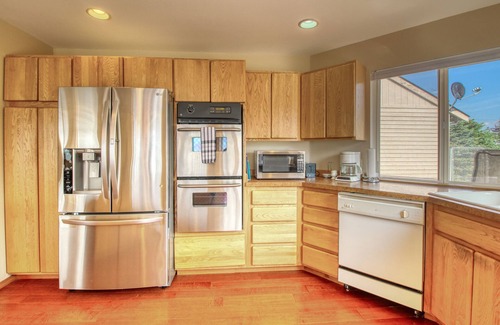 Helios Hills House | Spacious & Welcoming Home with Lake View, Private Hot Tub, & Wraparound Deck