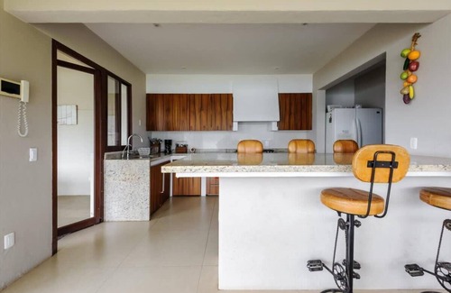 El Santuario House | Spectacular lakefront home with pool